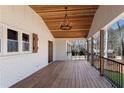 Inviting covered porch featuring a wood plank ceiling and modern railing at 2681 Beckwith Se Trl, Marietta, GA 30068