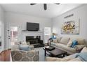 Spacious living room with vaulted ceiling, fireplace, and hardwood floors is perfect for entertaining and relaxation at 1772 Ascot Nw Run, Acworth, GA 30102