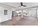Open concept living room boasts neutral paint, modern ceiling fan, and vinyl plank flooring at 5205 Silhouette Sw Ln, Mableton, GA 30126