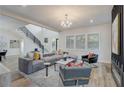 Inviting living room with a comfortable sofa, stylish decor, and ample natural light from large windows at 2014 Cambridge Ave, Atlanta, GA 30337