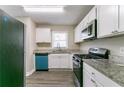 The spacious kitchen features granite countertops and stainless steel appliances at 2818 Mcafee Rd, Decatur, GA 30032