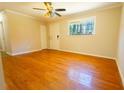 Spacious bedroom with hardwood floors, bright window, and closet for ample storage at 8684 Chestnut Ln, Lithia Springs, GA 30122