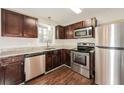 Well-equipped kitchen with stainless steel appliances and dark wood cabinetry at 2379 Ridgeway Dr, Atlanta, GA 30360