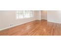 Bright living room featuring gleaming hardwood floors and large windows at 2379 Ridgeway Dr, Atlanta, GA 30360