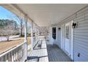 Cozy front porch features a swing and classic railings, perfect for relaxing outdoors at 1294 Summit Chase Dr, Snellville, GA 30078