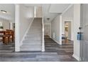 Inviting foyer with wood-look floors, staircase to the second floor, and view into other rooms at 4809 Thompson Mill Rd, Lithonia, GA 30058