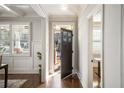 Elegant entryway with hardwood floors, decorative glass window and a view into the house at 625 Glenwood Se Pl, Atlanta, GA 30316