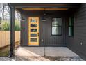 Covered porch with a yellow door and black accents at 1103 Boulevard Se Dr, Atlanta, GA 30317