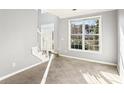 Inviting entryway with staircase and large window providing natural light at 2740 Barimore Pl, Dacula, GA 30019