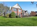 Beautiful two-story brick home with lush green lawn and mature trees at 2740 Barimore Pl, Dacula, GA 30019