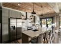 The kitchen features modern appliances, a large island, and access to an outdoor patio at 890 Memorial Se Dr # 101, Atlanta, GA 30316