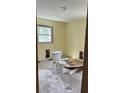 Bathroom in need of renovation with a new toilet and damaged flooring, presenting an opportunity for customization at 2298 Swallow Se Cir, Atlanta, GA 30315