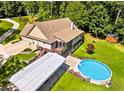 Sprawling backyard featuring a deck, shed, above-ground pool, and green space at 2517 N Hightower Trl, Conyers, GA 30012