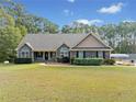 Charming single-story home with manicured lawn and well-maintained landscaping at 2517 N Hightower Trl, Conyers, GA 30012