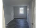 A cozy bedroom featuring a bright window and freshly painted walls at 624 S Grand Nw Ave, Atlanta, GA 30318