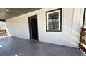 Spacious porch with a tiled floor, wood railing and siding at 624 S Grand Nw Ave, Atlanta, GA 30318