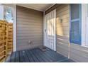 A charming entryway features a secure iron gate and a cozy welcome mat on the blue painted wood porch at 660 Simmons St, Atlanta, GA 30318