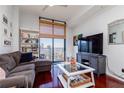Spacious living room offering expansive city views, stylish decor, and natural lighting at 3040 Peachtree Nw Rd # 1509, Atlanta, GA 30305