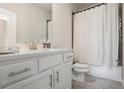 Clean bathroom with white vanity, modern fixtures, and shower-tub combo at 4327 Water Elm Aly, Doraville, GA 30360