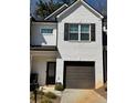 The townhome with a one-car garage is painted in neutral colors and well maintained at 3181 Meadowstone Ln, Atlanta, GA 30331