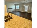 Spacious living room with dark, wood-look flooring and plenty of natural light at 3181 Meadowstone Ln, Atlanta, GA 30331