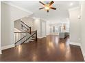 Open concept living space with hardwood floors, staircase and views of the kitchen and dining area at 513 Broadview Ln, Atlanta, GA 30324