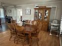 Traditional dining room with wood furniture, a china cabinet, and bright windows at 4536 Amy Rd, Snellville, GA 30039