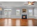 Spacious living area featuring hardwood floors, fireplace and ample natural light at 2393 Strand Ave, Lawrenceville, GA 30043