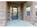 Charming front entrance with a decorative stone facade, glass door, and accent lighting at 3070 Staglin Dr, Powder Springs, GA 30127