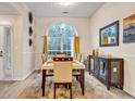 Bright dining room featuring a large window, modern furniture, and stylish decor at 2327 Maple Ave, Morrow, GA 30260