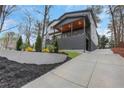Lovely home showcasing the extended driveway and landscaped yard at 2497 Wawona Ne Dr, Brookhaven, GA 30319
