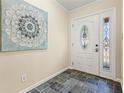 Inviting foyer featuring a decorative glass front door and slate tile flooring, creating a warm entrance at 2519 Lauderdale Ne Dr, Atlanta, GA 30345