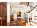 Entryway with wooden floors, staircase, and traditional decor at 2980 Bakers Meadow Se Ln, Atlanta, GA 30339