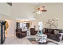 Welcoming living room with a white fireplace, brown leather furniture, and open floorplan at 740 Helga Ne Dr, Woodstock, GA 30188