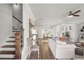 Open-concept floor plan featuring wood floors, a staircase, and lots of natural light at 213 Saratoga Dr, Acworth, GA 30102