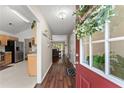 Inviting home entryway with hardwood floors, a stylish wreath on the door, and views of the kitchen and living spaces at 2405 Landrum Ct, Lawrenceville, GA 30043