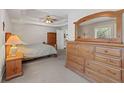 Serene main bedroom featuring a tray ceiling and comfortable furnishings at 2999 Paul Harris Rd, Dallas, GA 30157