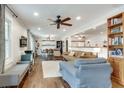 Bright living room with hardwood floors, modern furnishings, and a seamless flow to the dining area at 2031 Audubon Ne Dr, Atlanta, GA 30329