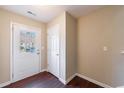 Bright entryway featuring a front door with glass inserts, hardwood flooring, and ample natural light at 3326 Waldrop Trl, Decatur, GA 30034