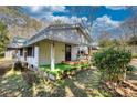Home with green turf on the porch, offering a cozy and inviting outdoor space at 5500 Rockbridge Road, Stone Mountain, GA 30088