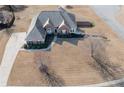 Sprawling property showcases an estate home with mature landscaping and a circular driveway at 108 Jasmine Way, Villa Rica, GA 30180