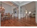 Elegant dining room features beautiful hardwood floors, chandelier, and wainscoting at 108 Jasmine Way, Villa Rica, GA 30180