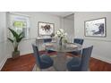 Cozy dining room featuring a glass table, seating for four, and stylish decor at 290 Lakemoore Ne Dr # C, Atlanta, GA 30342