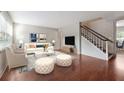 Bright living room showcasing stylish furniture, a modern rug, and sleek hardwood floors at 290 Lakemoore Ne Dr # C, Atlanta, GA 30342