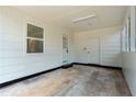 Convenient carport featuring a utility door, extra storage, and ample lighting at 1506 Sycamore Nw Dr, Kennesaw, GA 30152