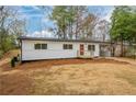 Inviting home featuring fresh exterior paint, manicured lawn, and driveway at 1506 Sycamore Nw Dr, Kennesaw, GA 30152