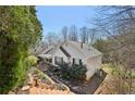 View of the back of the house showing the well-maintained yard and exterior details at 172 Shallow Ridge Ne Ln, Kennesaw, GA 30144