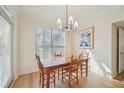 Charming dining room with a wooden table set, contemporary lighting fixture, and natural light at 3777 Peachtree Ne Rd # 1007, Atlanta, GA 30319