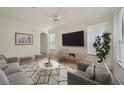 Cozy living room with hardwood floors, neutral tones, and modern furniture arrangement at 3777 Peachtree Ne Rd # 1007, Atlanta, GA 30319