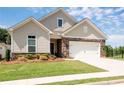 Charming single-Gathering home featuring stone accents, a two-car garage, and a beautifully landscaped front yard at 4902 Pleasantry Way, Acworth, GA 30101